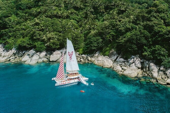Phuket: Aeolos Catamaran Tour to Coral & Racha Islands + Lunch - The slide, paddleboards, kayak, and fishing