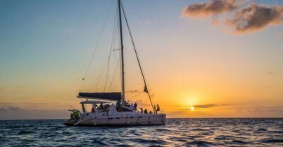 Coral Island & Sunset Dinner by Sailing Catamaran