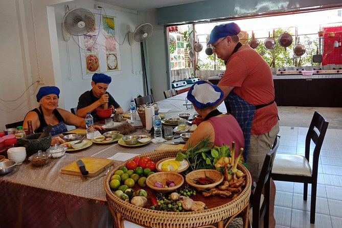 Phuket Easy Thai Cooking Class and Market Tour - Cooking in an open kitchen near Rawai