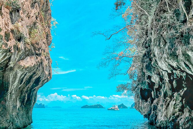 Phuket: Phang Nga Bay Bioluminescent Plankton and Sea Canoes tour - James Bond Island: famous scenery, limited time on the ground